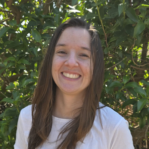 Joanna in front of hedge
